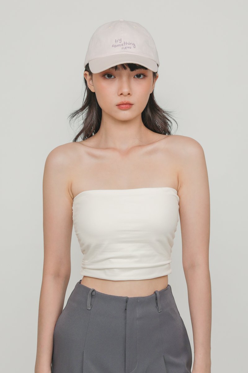 https://d1q5bpl6sg45iv.cloudfront.net/sites/files/ttr/productimg/202211/800x1200/ines-off-white-ruched-tube-padded-top-image-4-the-tinsel-rack-singapore.jpg